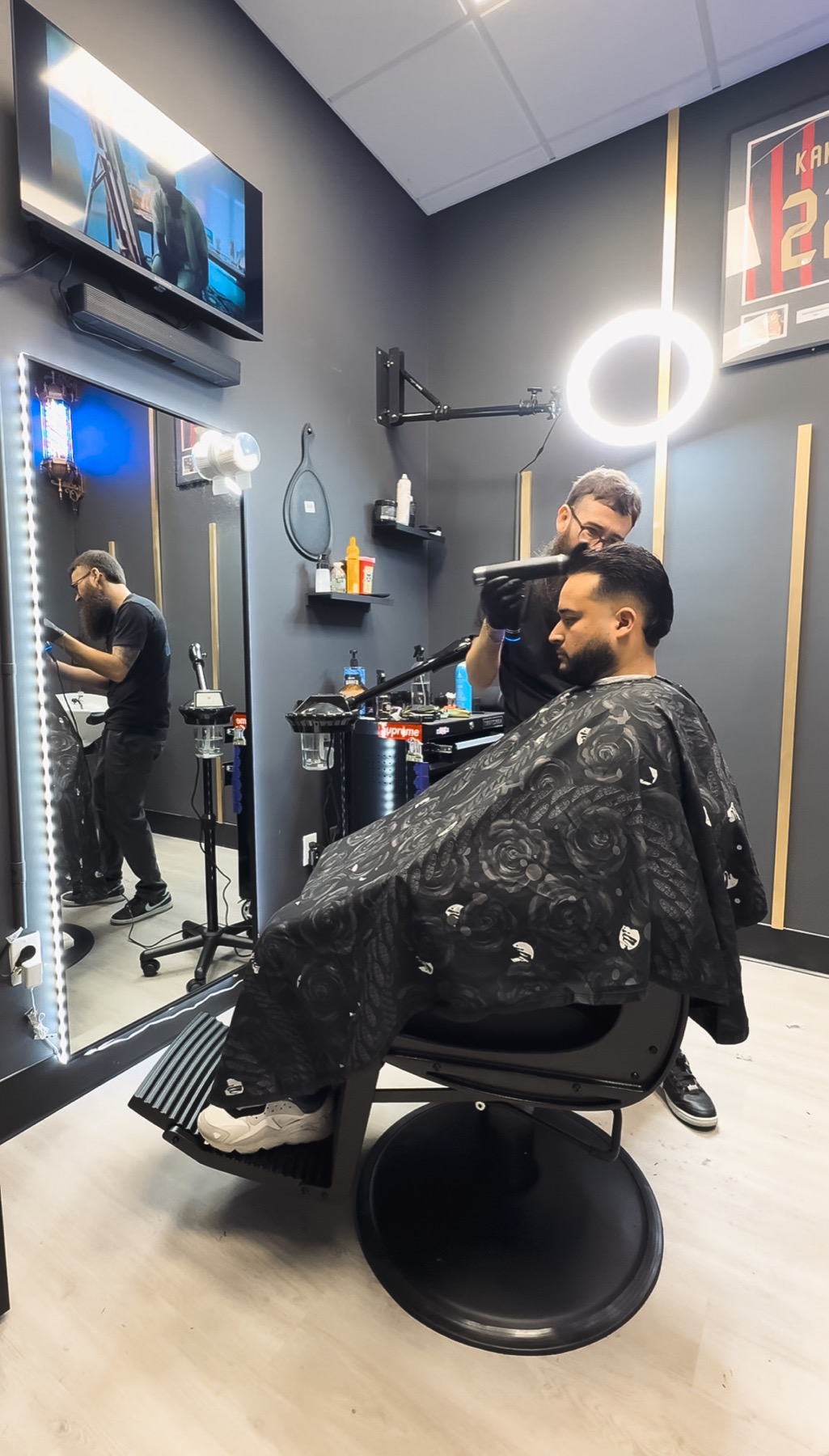 Celin working inside the real DNA Barbershop studio