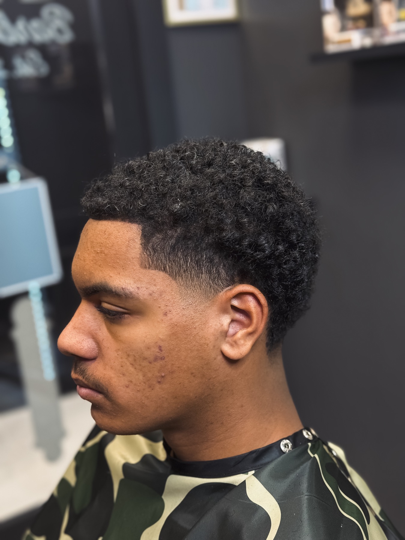 Natural curls and fade by DNA Barbershop